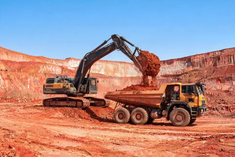 Mass excavation with large excavator and hauler