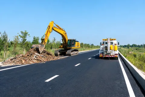 Excavator clearing for striping crew